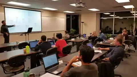 Speaker presenting software tools to bootcamp students